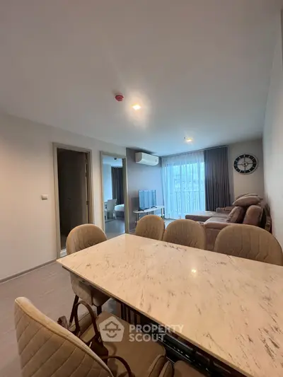 Spacious living room with elegant dining area and modern decor