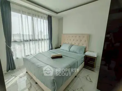Bright and cozy bedroom with large window and elegant decor in modern apartment.
