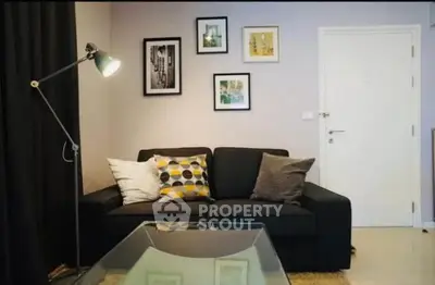 Stylish living room with modern decor and cozy sofa in a chic apartment.