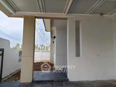 Modern exterior entrance with sleek design and tiled flooring