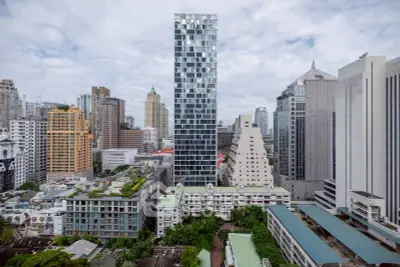Stunning cityscape view showcasing modern high-rise buildings and lush greenery.
