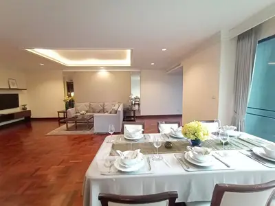 Spacious living and dining area with elegant decor and natural light