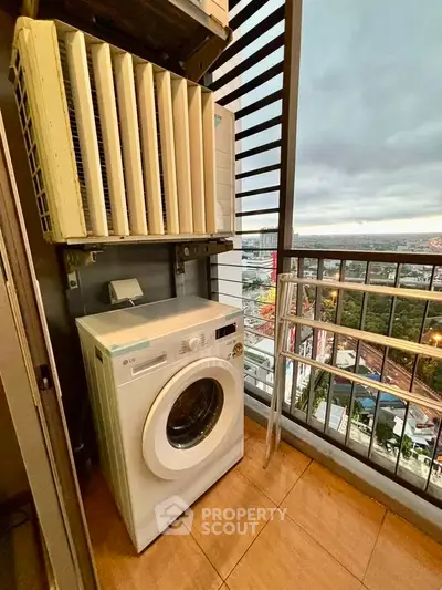 High-rise balcony with washing machine and city view, perfect for urban living convenience.