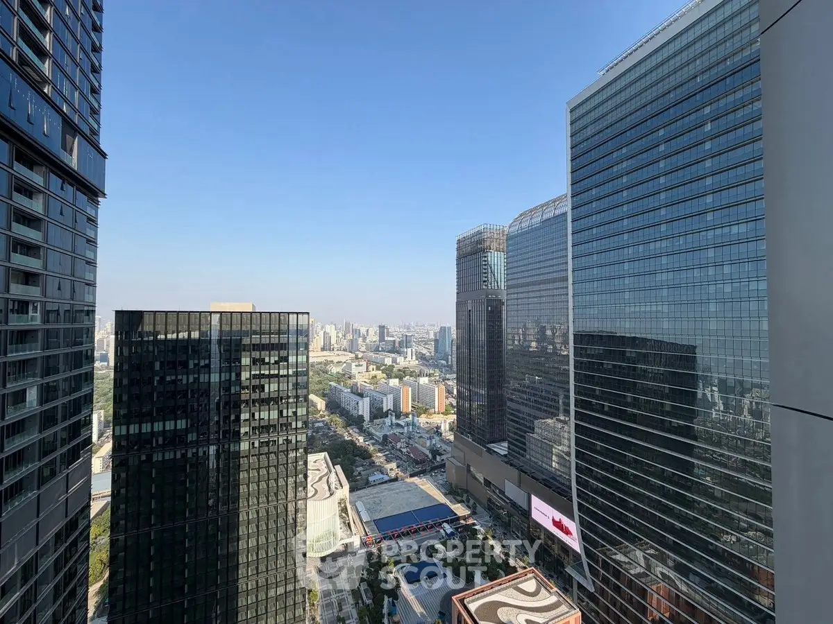 Stunning cityscape view from a high-rise building showcasing modern architecture and urban skyline.
