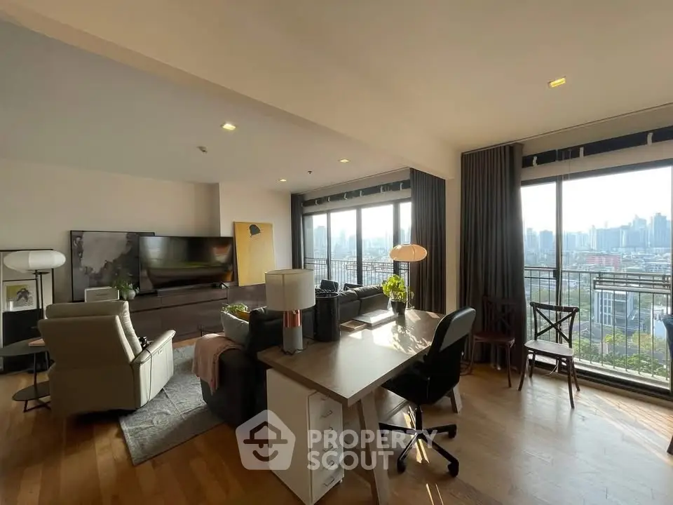 Spacious living room with city view, modern furniture, and natural light