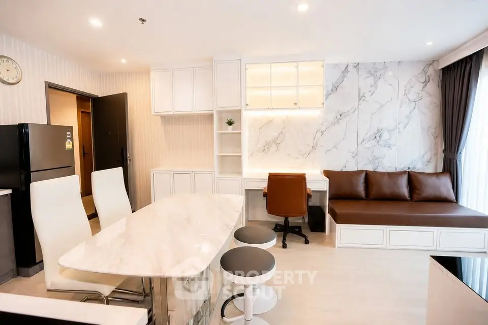Modern living room with marble accents and stylish furniture in a luxury apartment.