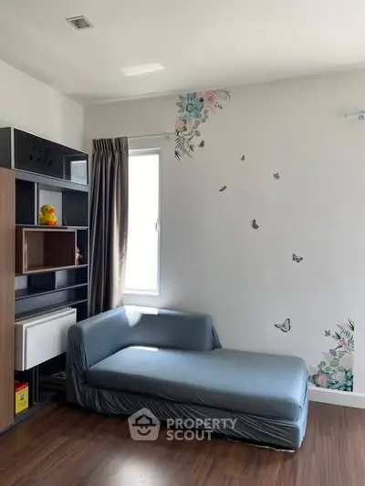 Charming living room with stylish decor and cozy seating, perfect for relaxation and entertainment.
