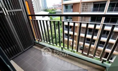 Charming balcony view in modern apartment with cityscape backdrop.