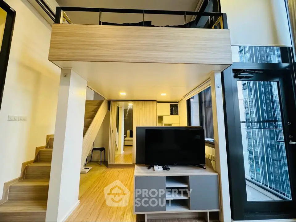 Modern loft apartment with mezzanine and large windows in urban setting