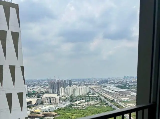Stunning cityscape view from a high-rise balcony, showcasing urban skyline and expansive horizon.