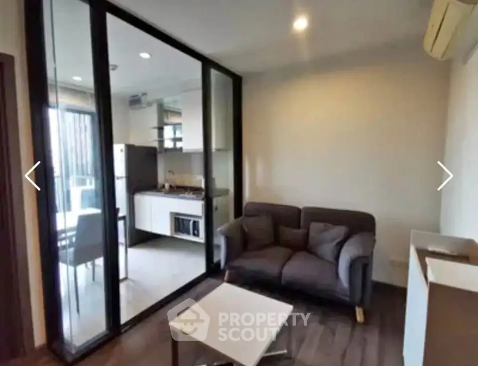 Modern apartment with cozy living room and sleek kitchen design