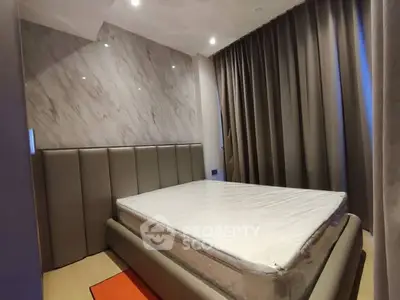 Modern bedroom with stylish design and luxurious bed in a contemporary apartment.