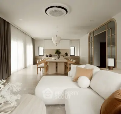 Luxurious open-plan living room with elegant decor and spacious dining area