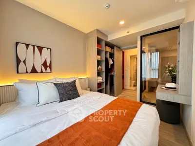 Modern bedroom with stylish decor and ample storage space