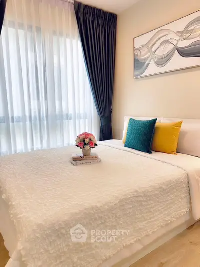 Elegant bedroom with modern decor, featuring a cozy bed, stylish curtains, and chic wall art.