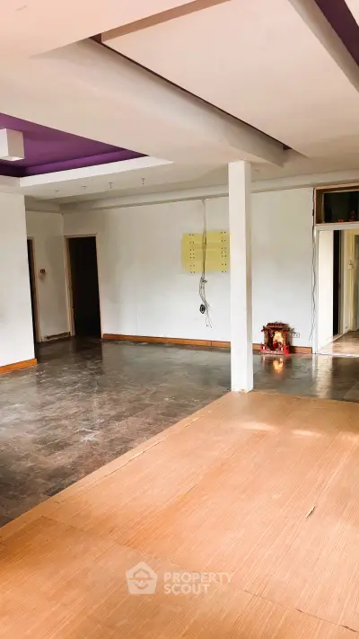 Spacious open-plan interior with potential for customization, featuring a partially finished floor and modern ceiling design.
