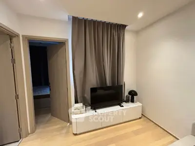 Modern living room with sleek TV stand and cozy ambiance