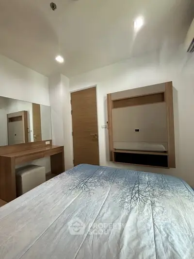 Cozy bedroom with modern wooden furniture and stylish decor, perfect for relaxation and comfort.