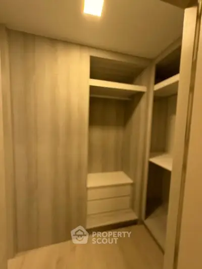 Spacious walk-in closet with modern shelving and ample storage space.
