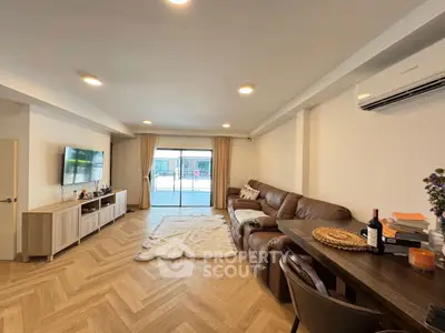 Spacious living room with stylish decor and natural light