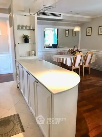 Elegant dining area with open kitchen layout and stylish decor