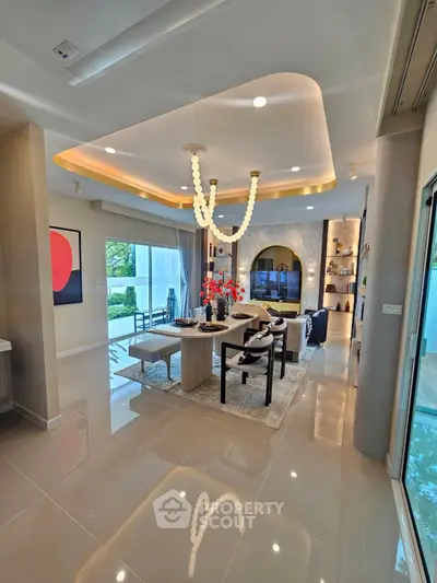 Luxurious modern living room with elegant chandelier and stylish decor