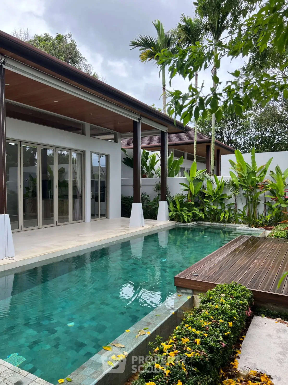 Luxurious tropical villa with private pool and lush garden, perfect for serene living.