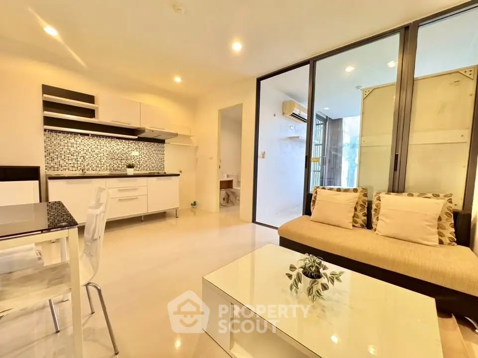 Modern open-plan living room with stylish kitchen and cozy seating area