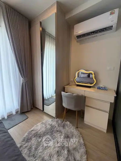 Cozy bedroom corner with stylish vanity and air conditioning
