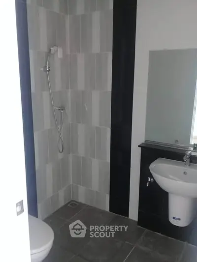 Modern bathroom with sleek tiles and minimalist fixtures