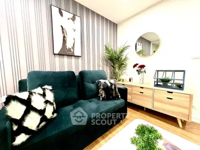 Stylish living room with modern decor, plush green sofa, and chic wall art, perfect for contemporary living.