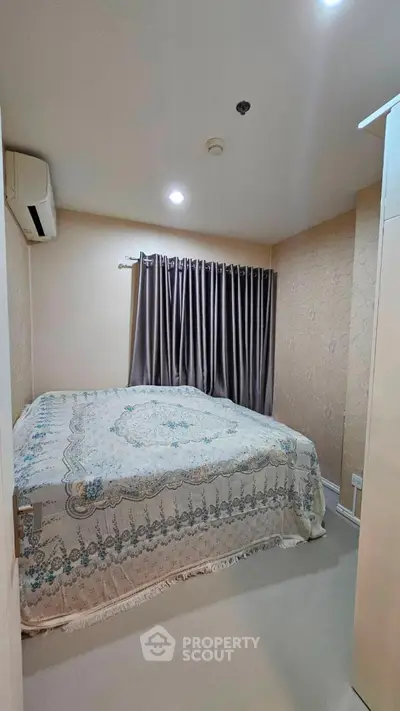 Cozy bedroom with elegant decor and ample natural light