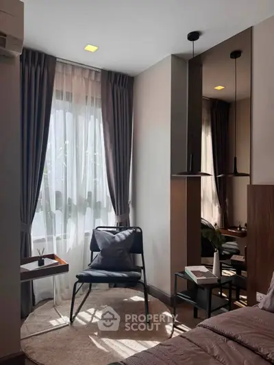 Cozy bedroom corner with modern decor and natural light