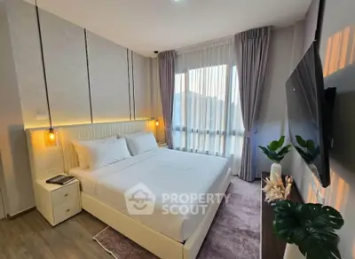 Modern bedroom with elegant decor and large window for natural light