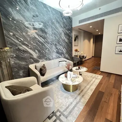 Luxurious modern living room with marble accent wall and elegant furniture