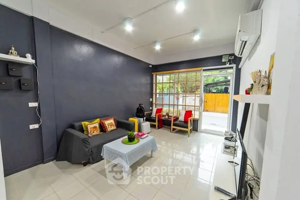 Modern living room with stylish decor and ample natural light