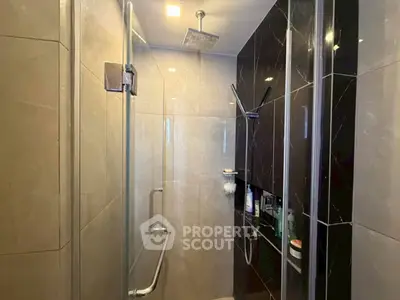 Modern bathroom with sleek glass shower and elegant tile design