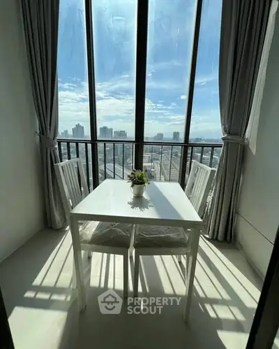 Bright dining area with stunning city view through large windows