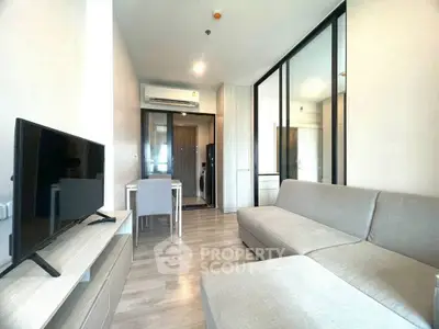 Modern living room with sleek furniture and open layout in stylish apartment.