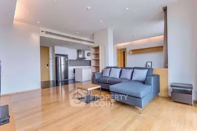 Spacious modern living room with open kitchen and stylish furniture