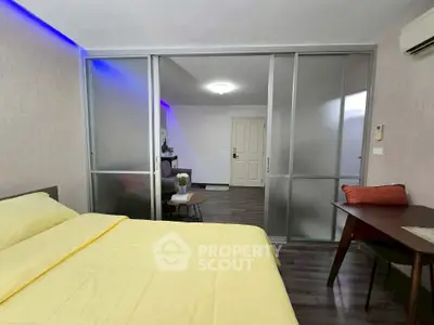 Modern bedroom with sliding glass doors and cozy decor