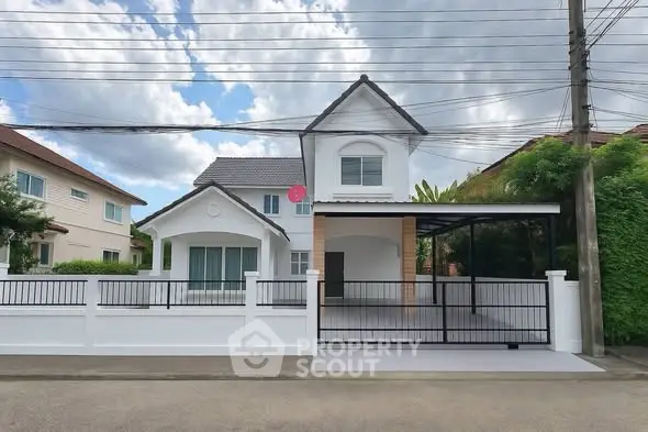 Charming two-story house with modern design and spacious driveway in a serene neighborhood.
