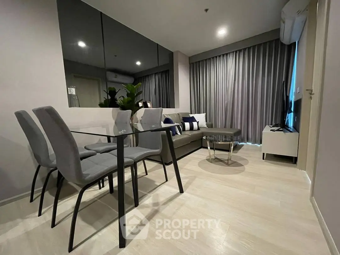 Modern living room with sleek furniture and stylish decor in a contemporary apartment.