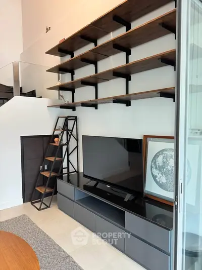 Modern living room with sleek TV unit and stylish shelving