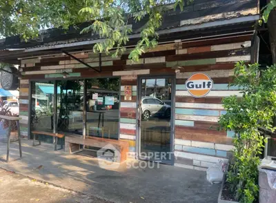 Charming rustic storefront with colorful wooden facade and Gulf sign, perfect for a cozy cafe or shop.