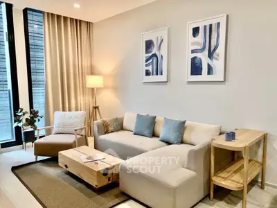 Modern living room with stylish furniture and abstract art, perfect for urban living.