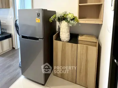 Modern kitchen with sleek fridge and stylish wooden cabinets
