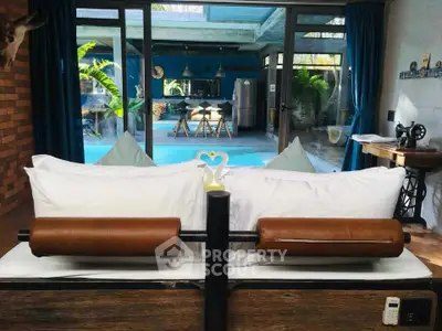 Luxurious bedroom with pool view and elegant decor