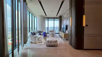 Luxurious high-rise living room with panoramic city views and elegant modern decor.