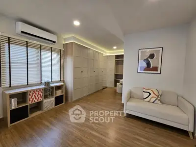 Spacious modern living room with elegant wooden flooring and stylish decor